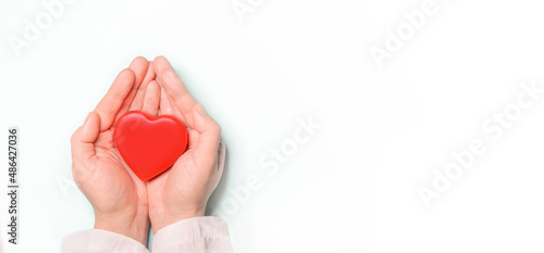 Red heart in Doctor 's hands on white background. Healthcare and hospital medical concept,organ donation concept.Symbolic of Valentine day.Heart day.?opy space.