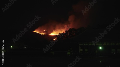 Fire Burning on distant Wakakusa Mountain in Nara Japan photo