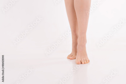 beautiful women's feet on white background