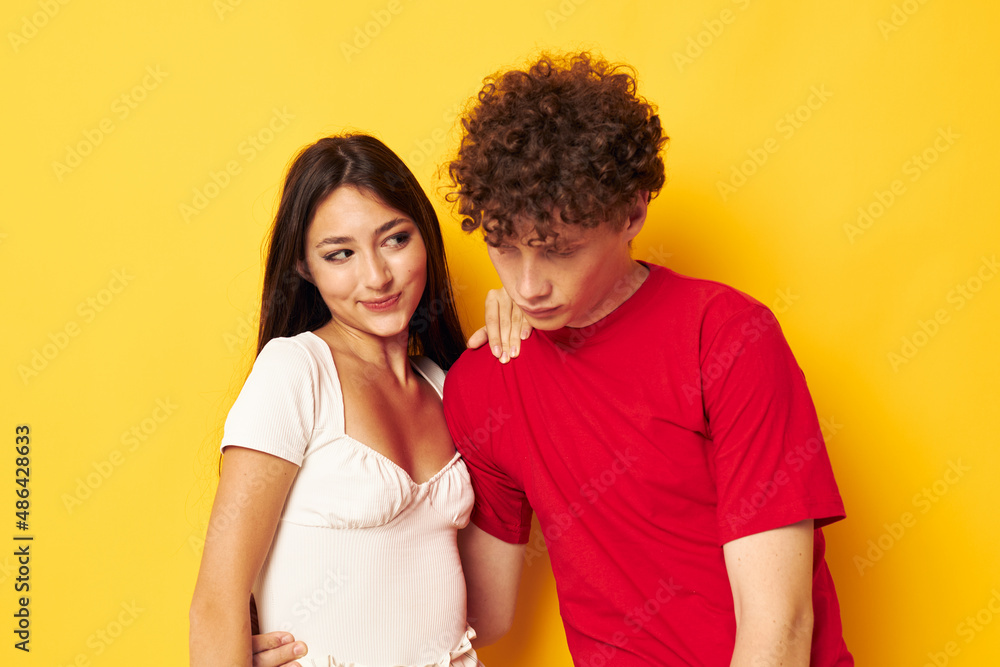 cute young couple together posing emotions close-up yellow background unaltered cute young couple together posing emotions close-up yellow background unaltered