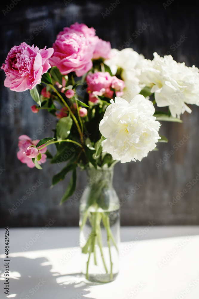 Dreamy flower bouquet of pink natural peonies flowers, spring and summer season bouquet