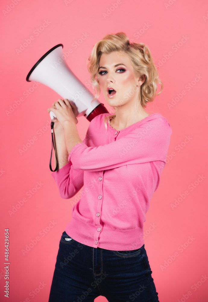 Woman girl posing on isolated background studio with megaphone. Screaming in megaphone. Idea for marketing or sales. Woman girl posing on isolated background studio with megaphone. Screaming in megaphone. Idea for marketing or sales.