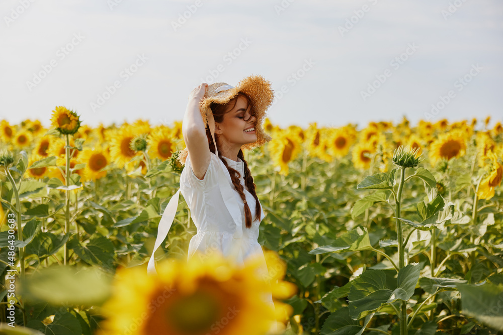 woman portrait In a field with blooming sunflowers unaltered woman portrait In a field with blooming sunflowers unaltered