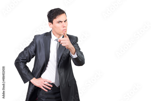 Photos Handsome serious entrepreneur pointing at camera while scolding