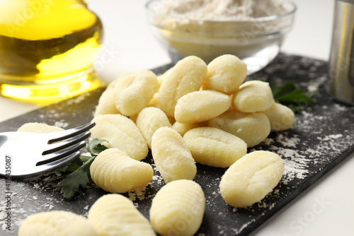 Concept of cooking with raw potato gnocchi, close up