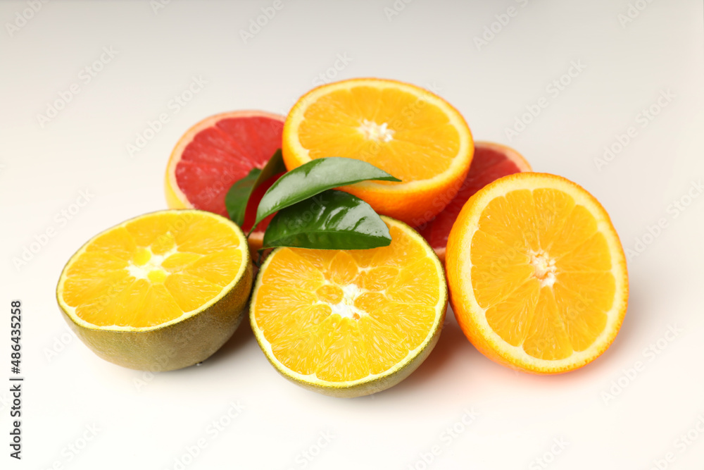 Concept of tasty food with citrus fruits on white background Concept of tasty food with citrus fruits on white background