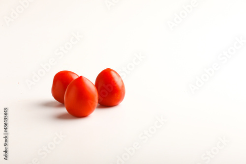 Fresh red tomato on white background. © Bilal