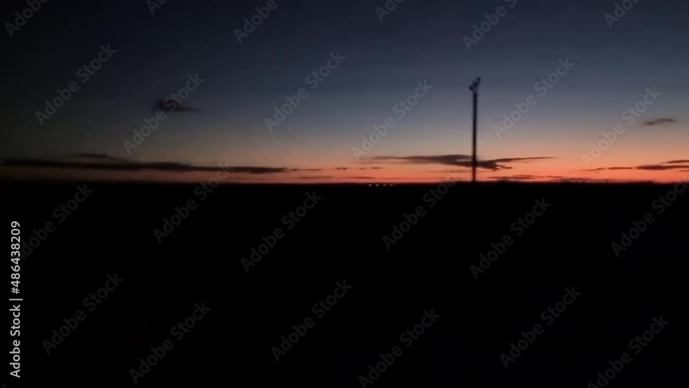 Driving in rural field area during sunset evening night Driving in rural field area during sunset evening night
