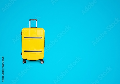 Colorful travel bag on blue background