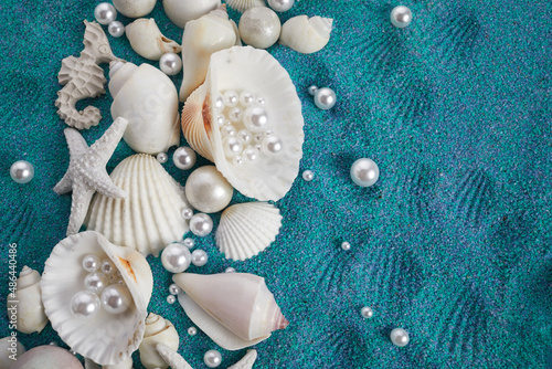 Sea shells and starfich on sand as background. Top view. Background for product presentation photo