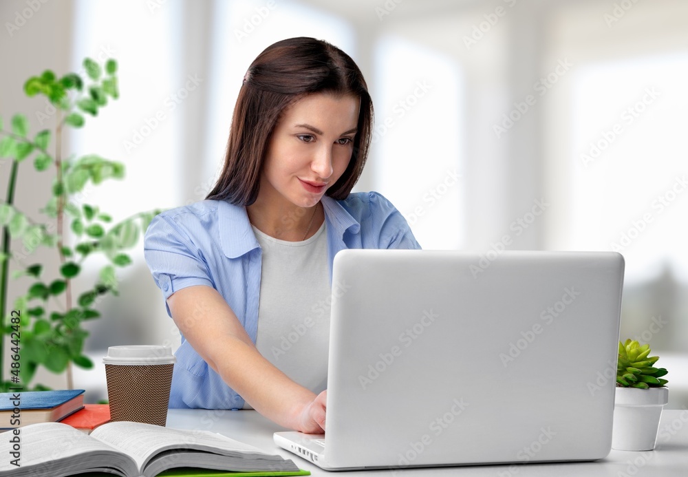 Portrait of Young woman freelancer is working her job in modern office. Portrait of Young woman freelancer is working her job in modern office.