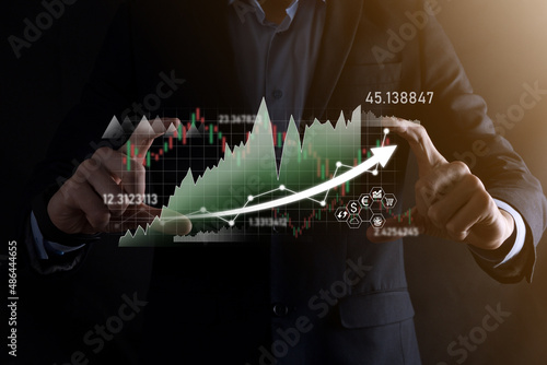 Hand hold sales data and economic growth graph chart. Business planning and strategy. Analysing trading of exchange. Financial and banking. Technology digital marketing.Profit and growing plan.