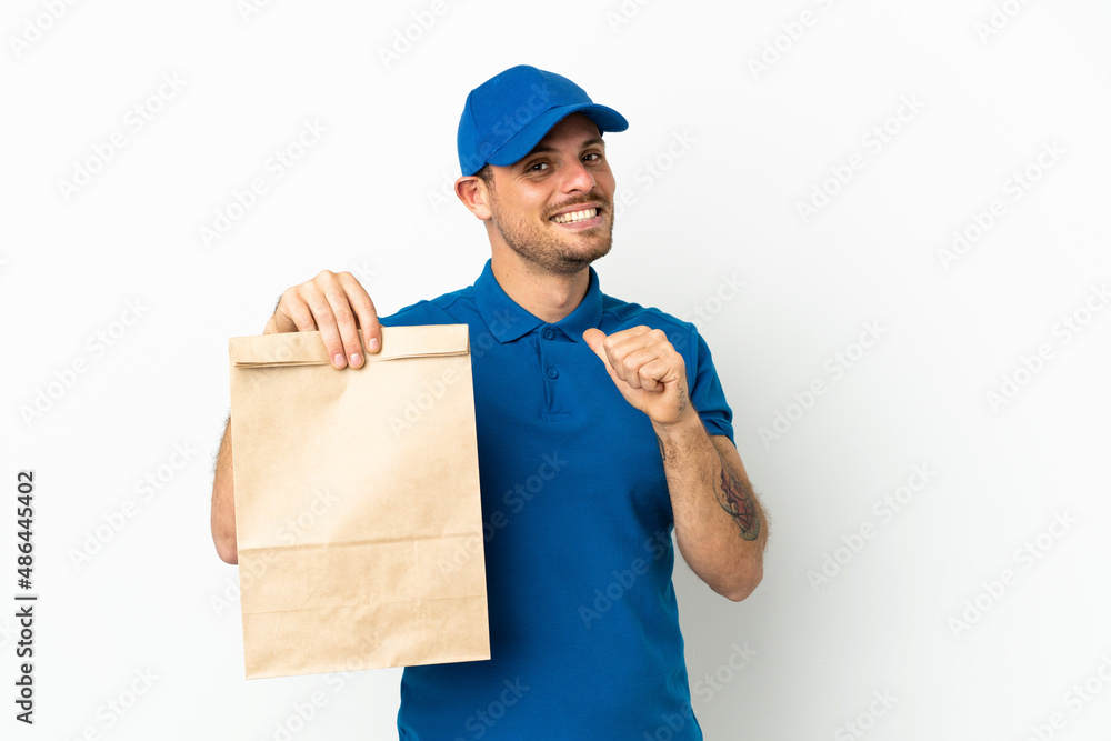 Brazilian taking a bag of takeaway food isolated on white background proud and self-satisfied Brazilian taking a bag of takeaway food isolated on white background proud and self-satisfied