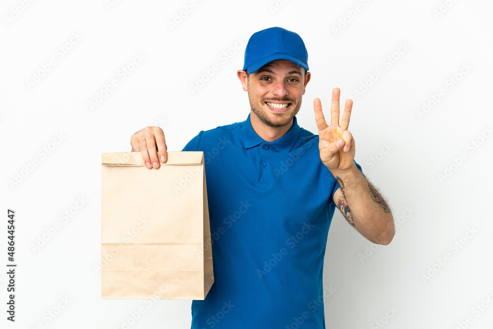 Brazilian taking a bag of takeaway food isolated on white background happy and counting three with fingers Brazilian taking a bag of takeaway food isolated on white background happy and counting three with fingers