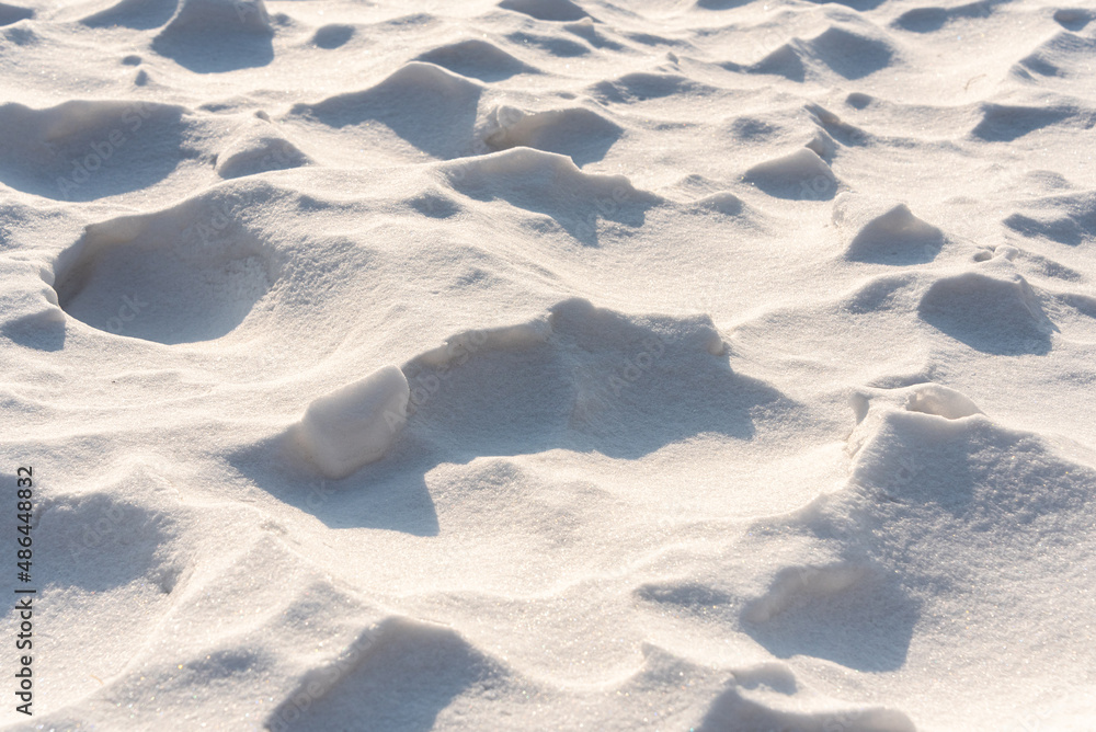 Beautiful winter background from snowdrifts. Natural texture of snow. patterns on the snowy surface Beautiful winter background from snowdrifts. Natural texture of snow. patterns on the snowy surface