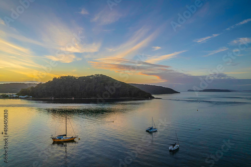 Aerial sunrise waterscape with boats