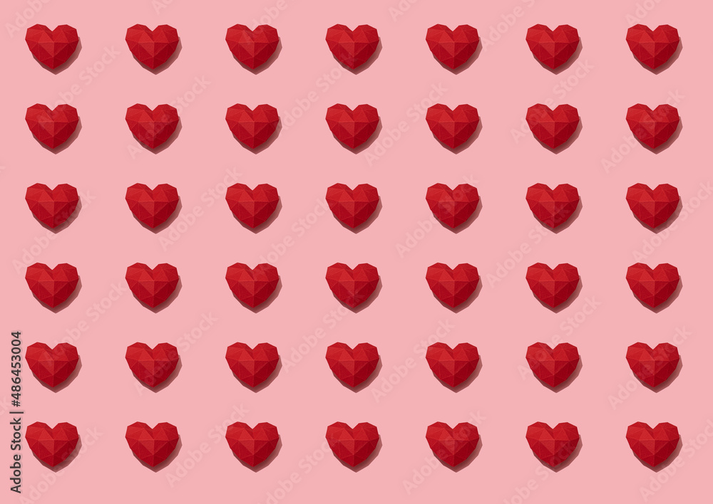 Red paper hearts pattern on pink background