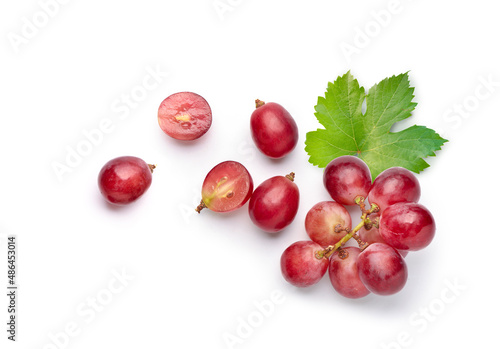 Obraz na plátně Flat lay (top view) of red grape with leaves on white background.