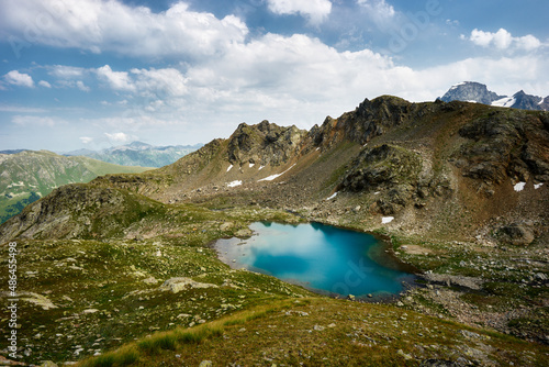 Alpine turquoise lake of Sofia, surrounded by rocks. Karachay-Cherkessia, Arkhyz. Russia