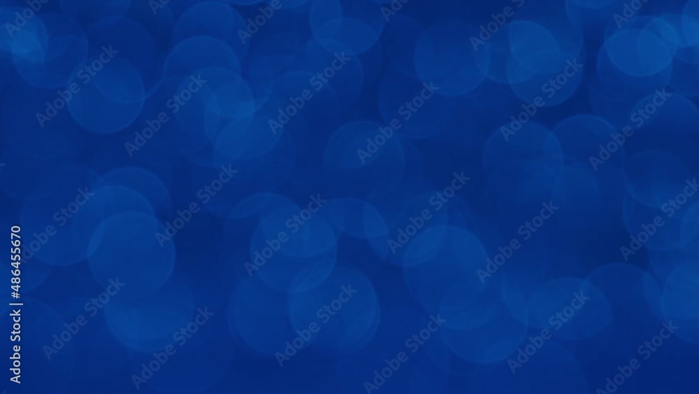 Moving blue glitter lights, defocused light reflections loopable bokeh background. Defocused Particles Background. Beautiful blue glowing bokeh, shallow depth of field, abstract background Moving blue glitter lights, defocused light reflections loopable bokeh background. Defocused Particles Background. Beautiful blue glowing bokeh, shallow depth of field, abstract background