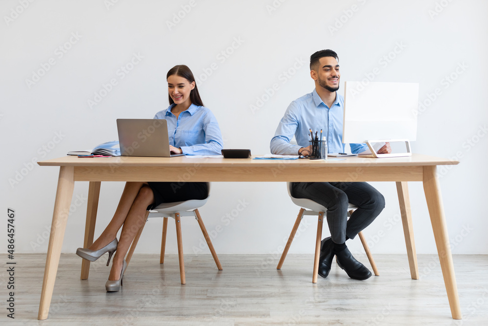 Portrait Of Smiling Colleagues Working At Office Together Portrait Of Smiling Colleagues Working At Office Together