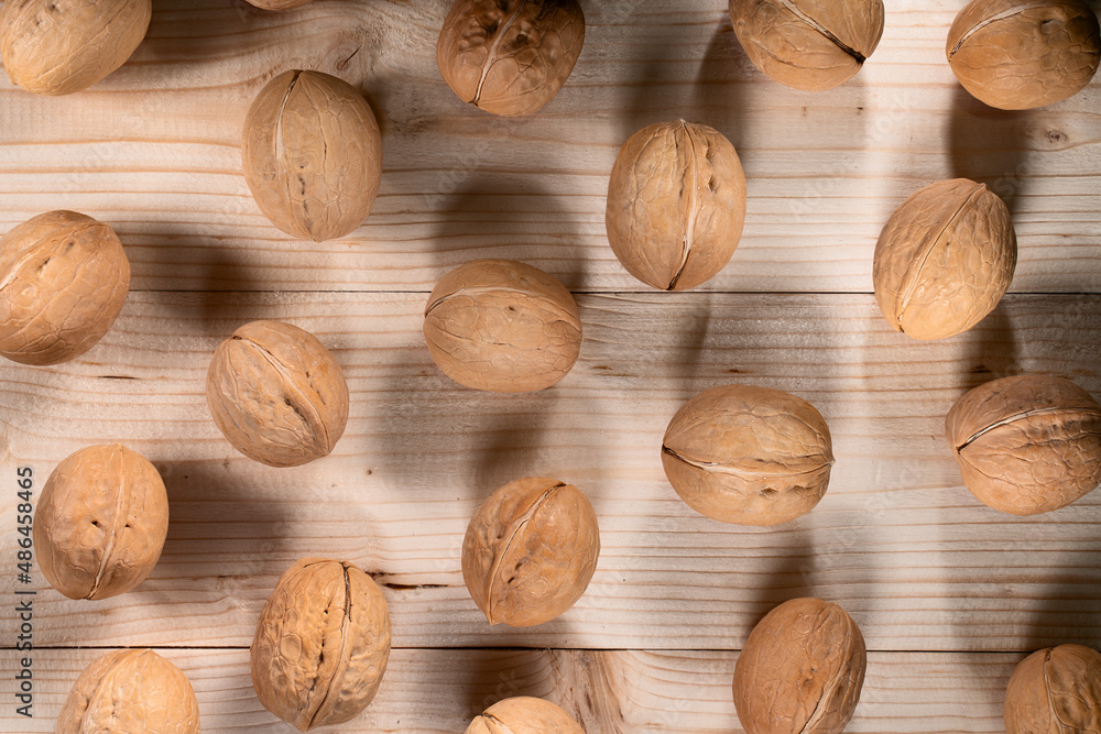 walnuts on a wooden surface top view walnuts on a wooden surface top view