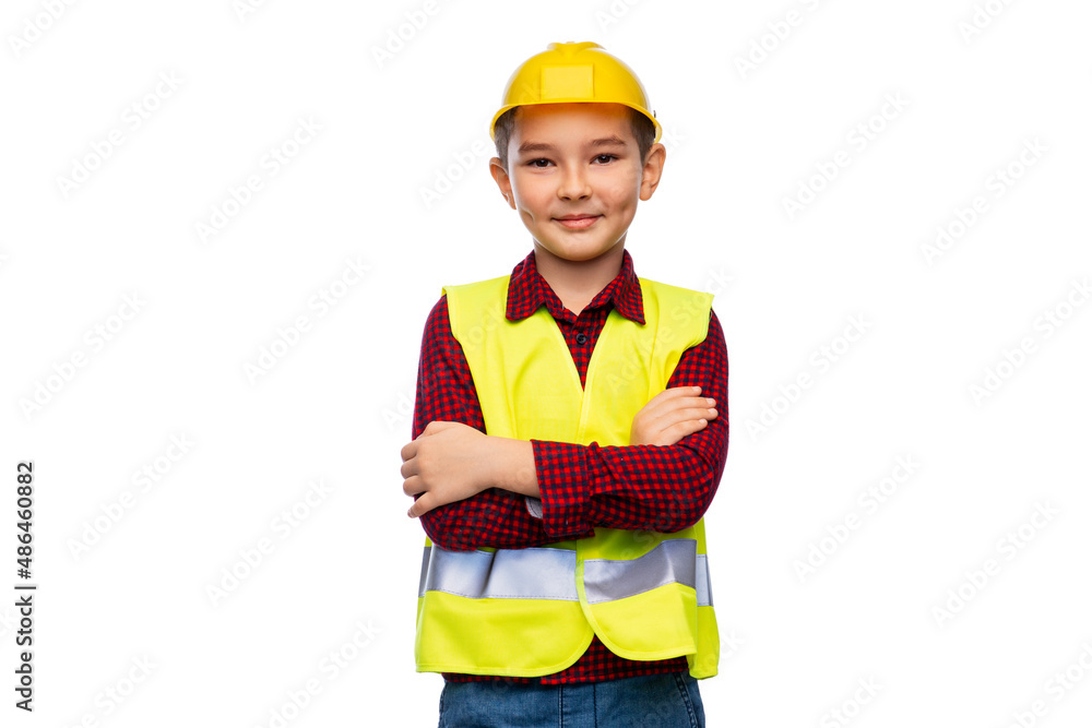 building, construction and profession concept - little boy in protective helmet and safety vest with crossed arms over white background building, construction and profession concept - little boy in protective helmet and safety vest with crossed arms over white background