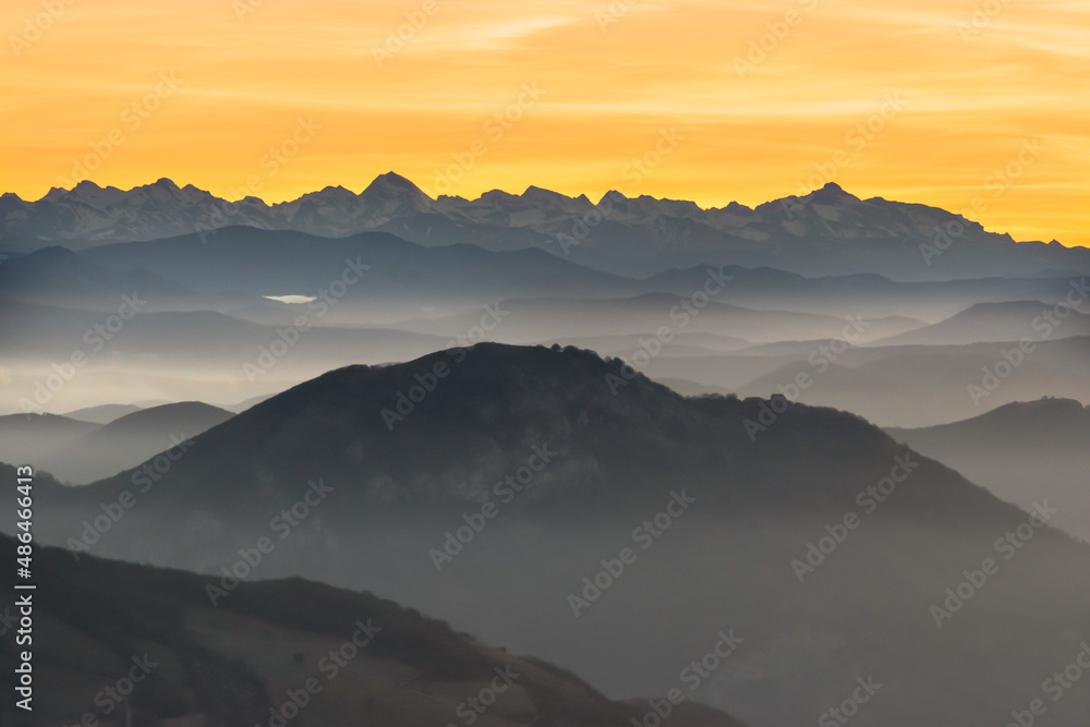 Silhouettes of the Navarrese mountains at dawn. Pyrenees in the background
