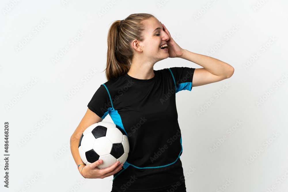 Young football player woman isolated on white background smiling a lot Young football player woman isolated on white background smiling a lot