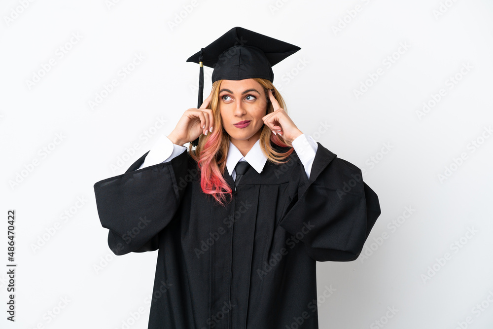 Young university graduate over isolated white background having doubts and thinking Young university graduate over isolated white background having doubts and thinking