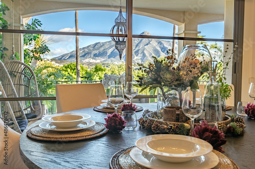 a view from a beautiful dining table inside a beautiful villa overlooking the mountains of Costa del Sol 