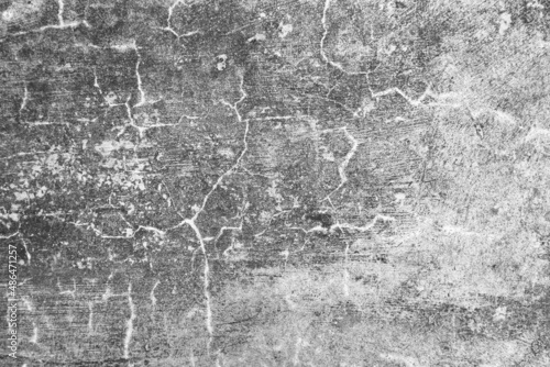 Old grunge dirty textured cement wall surface. With uneven stains and tiny holes.