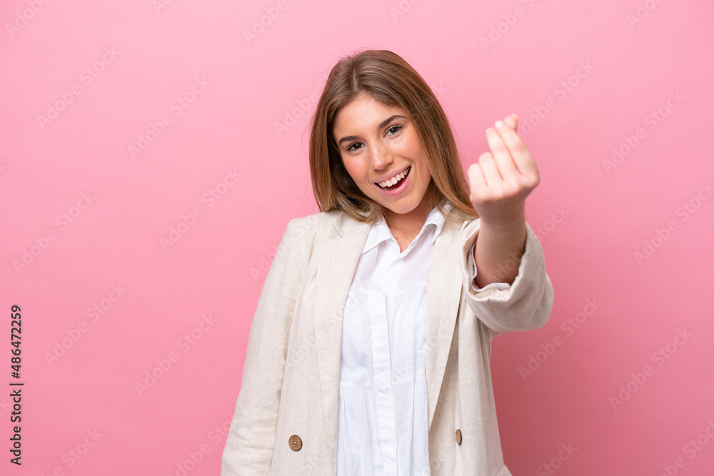 Young caucasian woman isolated on pink bakcground making money gesture Young caucasian woman isolated on pink bakcground making money gesture