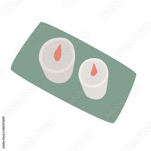 Set of two flat candles on a stand. View from above. The concept of warmth and comfort in the house.