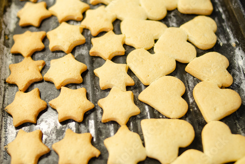 Ready-made shortbread cookies on a baking sheet close-up. Home and handmade food concept