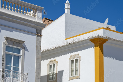 
typical chimney of Algarve on and whitewashed house in the old town of Tavira, Algarve, Portugal