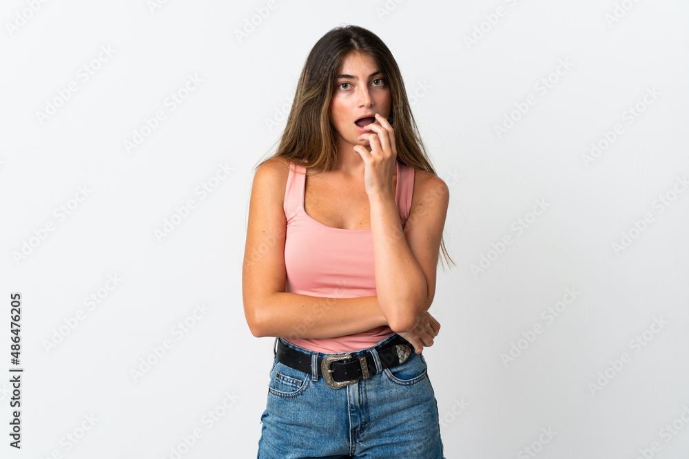 Young caucasian woman isolated on white background surprised and shocked while looking right Young caucasian woman isolated on white background surprised and shocked while looking right