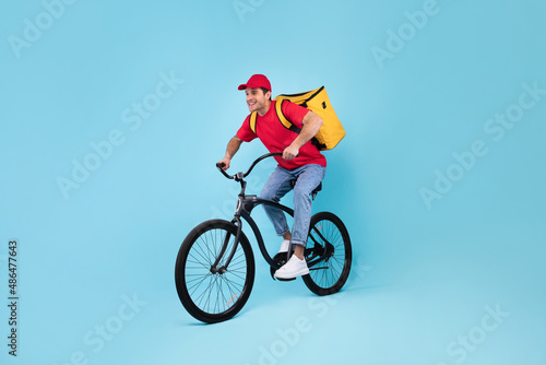 Courier With Backpack Bag Riding Bike Delivering Meal, Blue Background