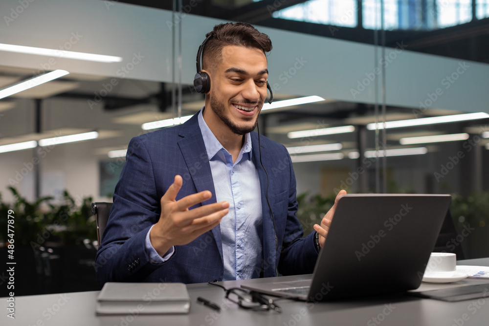 Positive middle eastern manager having video call with business partners Positive middle eastern manager having video call with business partners