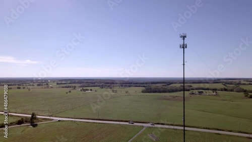 Rural cell phone tower in the middle of nowhere with 5G technology updates needed stock video by aerial drone footage 7 photo