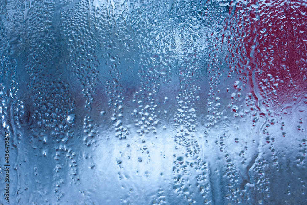 Fototapeta premium Condensation on the clear glass window. Water drops. Rain. Abstract background texture. Outside the window, bad weather, rain