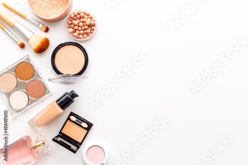 Decorative makeup cosmetic on color background, top view photo