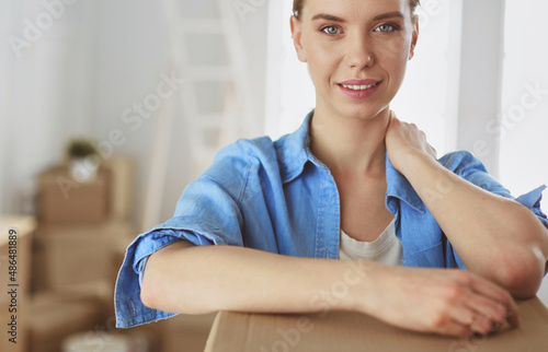 Portrait of a young woman with boxes © lenets_tan