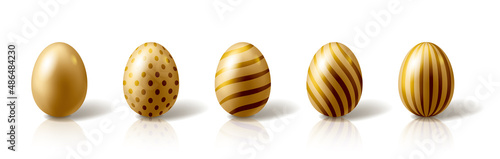 Canvas Set of golden Easter eggs on white background.