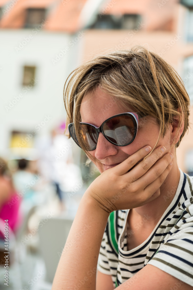 Portrait of a woman in summer clothes with a city background in Ingolstadt, Germany Portrait of a woman in summer clothes with a city background in Ingolstadt, Germany