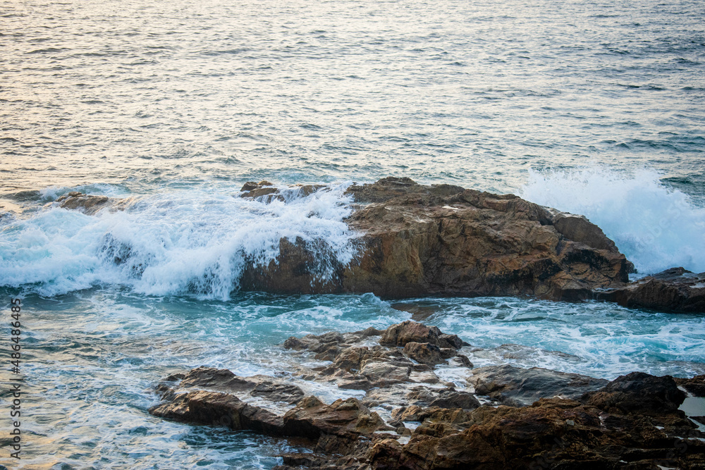 Ocean waves against rocks Ocean waves against rocks