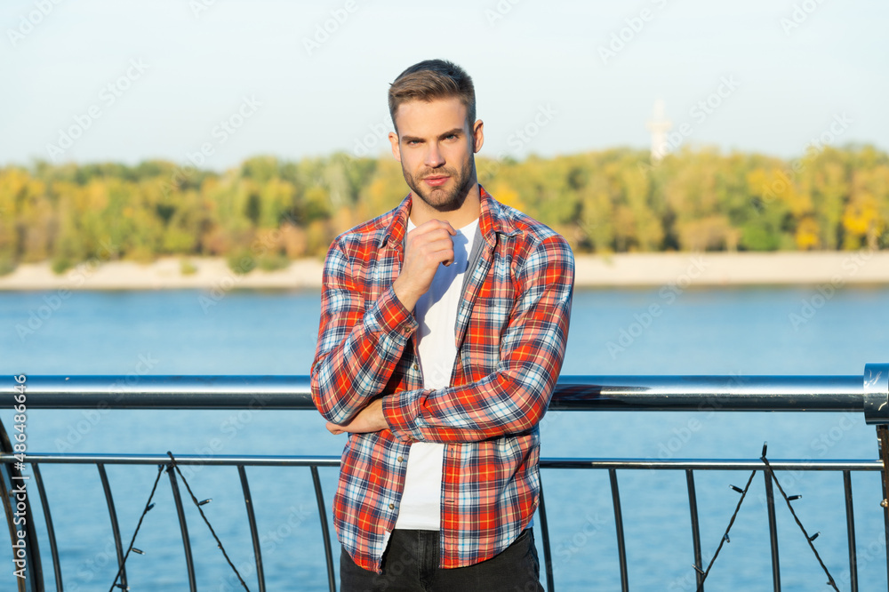 young unshaven guy outdoor. male fashion model. mens beauty.
