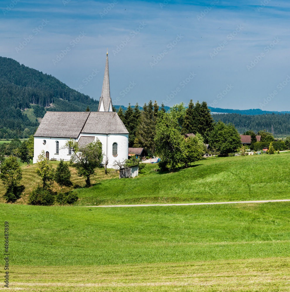 Scenic view of a chapel and green hills over the German countryside in the village Kappel Scenic view of a chapel and green hills over the German countryside in the village Kappel