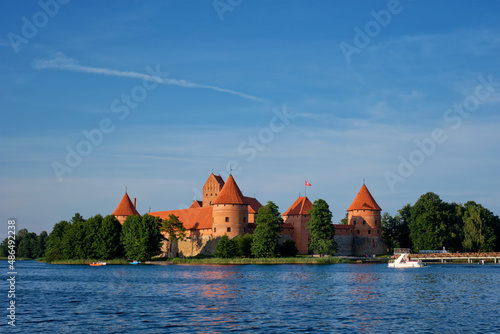 Trakai Island Castle in lake Galve with boats and yachts in summer day with beautiful sky  Lithuania. Trakai Castle is one of major tourist attractions of Lituania