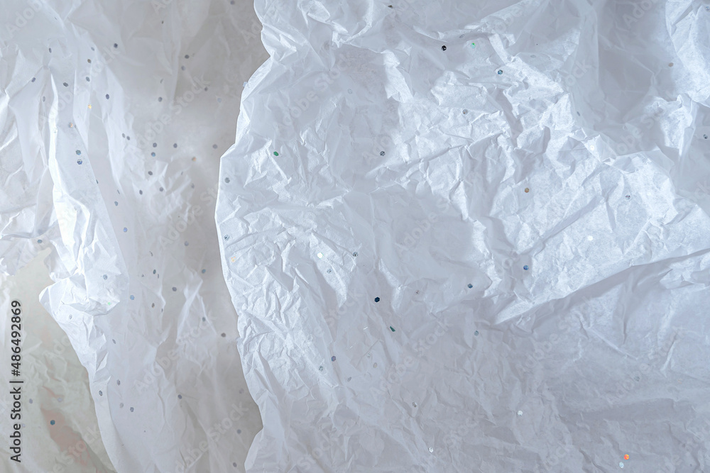 Abstract background with White crumpled wrapping paper with glitter Abstract background with White crumpled wrapping paper with glitter